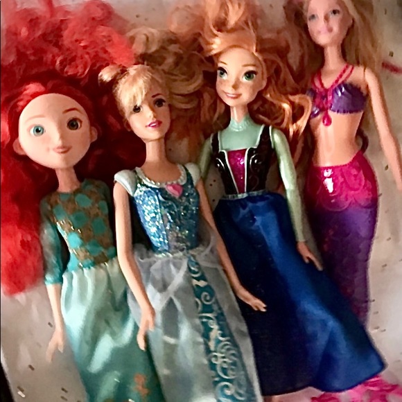 4 barbie dolls